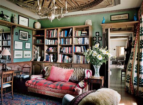 A Living Room Filled With Furniture And Bookshelves Covered In Lots Of