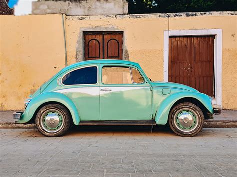 Teal Volkswagen Beetle Parked Near Brown House Hd Wallpaper Peakpx