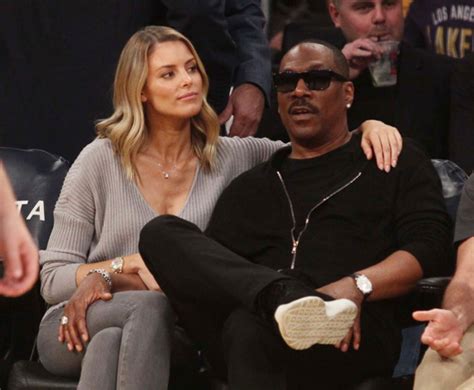 eddie murphy and paige butcher at the los angeles lakers game sandra rose