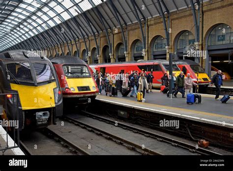 Passengers Leaving The Trains At London Kings Cross Station With Lner