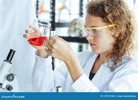 Young Female Researcher Working In Modern Biological Laboratory Stock