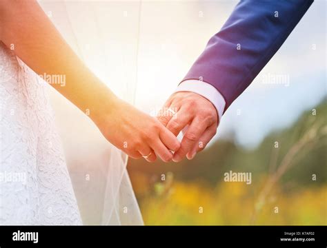 Wedding Couple Holding Hands Stock Photo Alamy