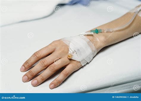 Woman S Patient Hand With Saline Intravenous Drip In The Hospital