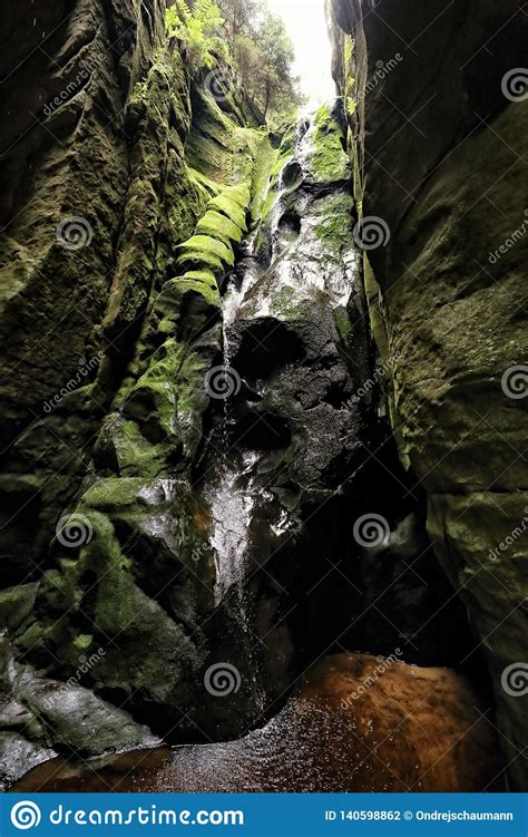 Waterfall Between Steep Rocks Covered By Moss Stock Photo Image Of