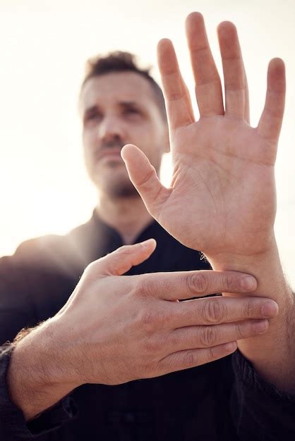 Premium Photo Man Hands And Tai Chi Pose Outdoor While Training For Health Wellness Or Fitness