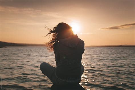 Young Woman Enjoying The Sunset Alone By Paff Artofit