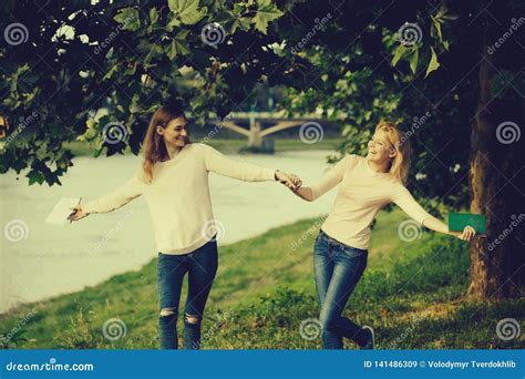 Two Young Girls Hold Hands Stock Image Image Of Young 141486309