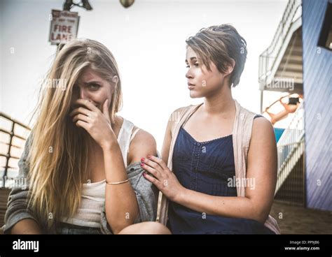 Young Woman Is Sad Crying And Being Consoled By Friend Stock Photo Alamy