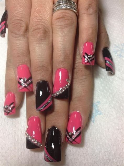 The way the pink mixes with black toward the root of the nail is the this artistically put textured contrast of pink with black is gonna give a great and cool look to your nails. Pink black silver nails | Black nail designs, Nails, Nail ...