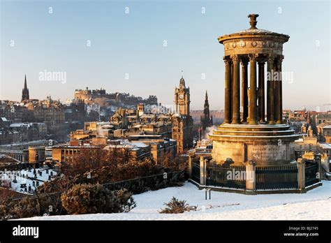 The Dugald Stewart Monument On Calton Hill With View Of City Skyline