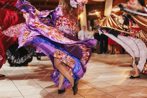 Premium Photo Beautiful Gypsy Girls Dancing In Traditional Purple Floral Dress At Wedding