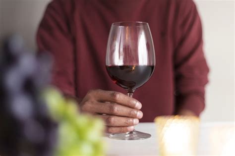 Download this free photo about man holding wine glass in the nature, and discover more than 9 million professional stock photos on freepik. Free Photo | Man holding red glass of wine