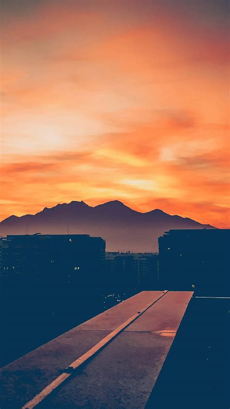 Download Sunset At A Rooftop 4k Ultra Iphone Wallpaper