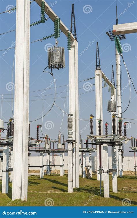 Part Of High Voltage Substation On Blue Sky Background With Switches
