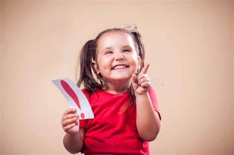 A Portrait Of Kid Girl Holding Card With Question Mark Childhood And