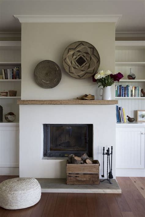 White marble finish surrounds complete with statues and ornate pillars can bring a touch of roman architecture to your room. interior design | Home fireplace, Simple fireplace ...