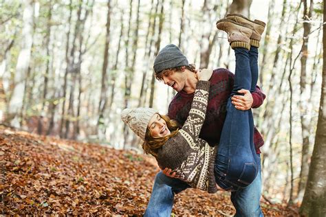 Couple In Love Having Fun Together On The Woods In Autumn By Stocksy Contributor
