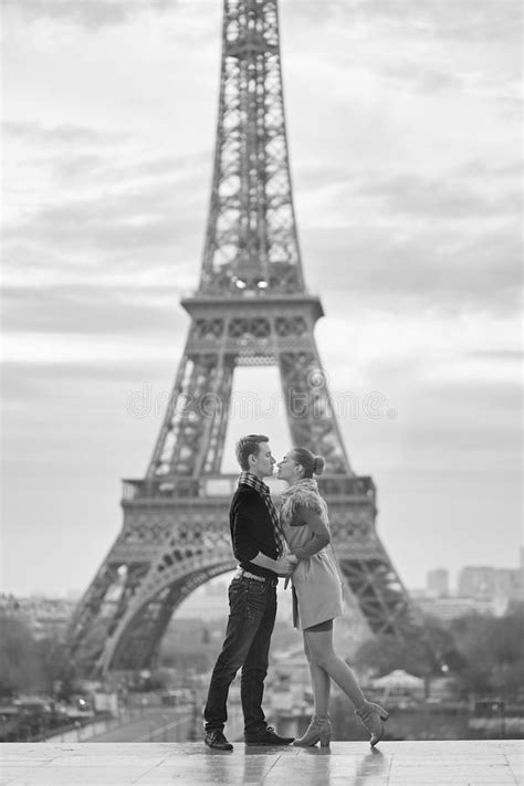 Young Romantic Couple Near The Eiffel Tower In Paris Stock Photo