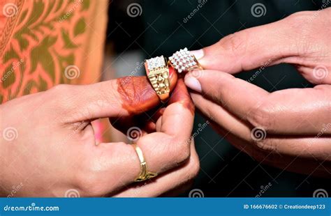 An Indian Bride And Groom Their Shows Engagement Rings During A Hindu