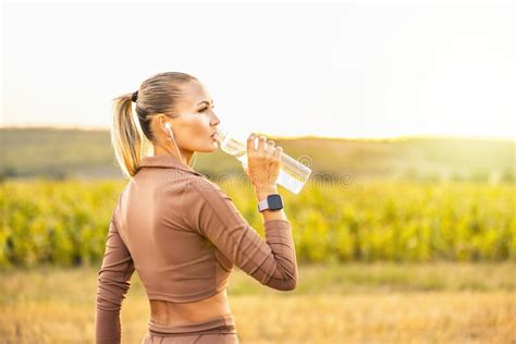 Young Woman Drinking Water After Jogginghealty And Sport Concept