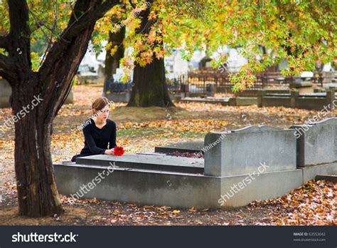 Without a will, distributing assets is trickier, but there's a system to help. Mourning Woman Laying Flower On Grave Stock Photo 63553042 ...