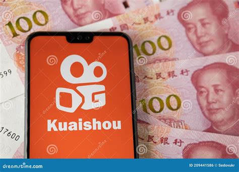 Kuaishou App Logo On The Smartphone Placed On Chinese Yuan Banknotes