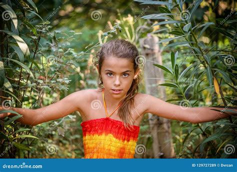 Portrait Of A Young Girl In The Bushes Stock Image Image Of Eyes