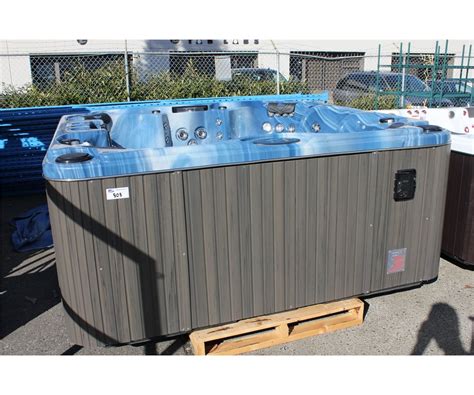 Cal Spas Escape Select Series Hot Tub With Sky Blue Interior And 8 Grey Cabinet C W