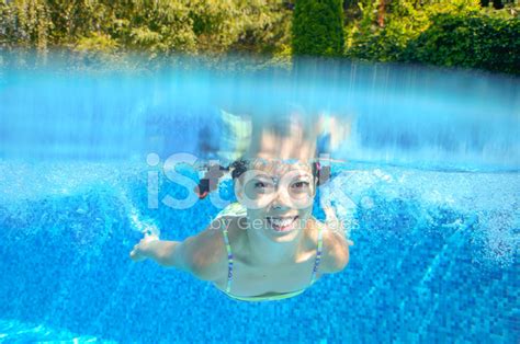 Happy Active Underwater Child Swims In Pool Stock Photo Royalty Free