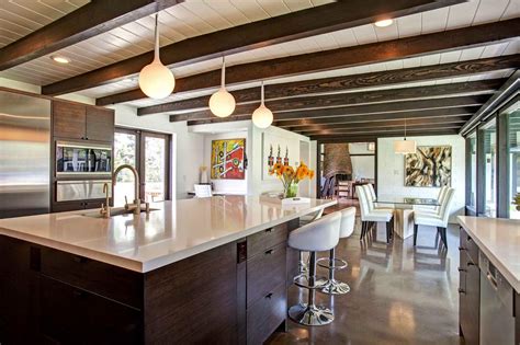 Essential home is the ultimate combination of retro design and contemporary details. Midcentury Modern Kitchen Features Spacious Island | HGTV