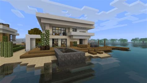 This modern mansion features a pool and a helipad. Modern House 5 - Beach Town Project Minecraft Project