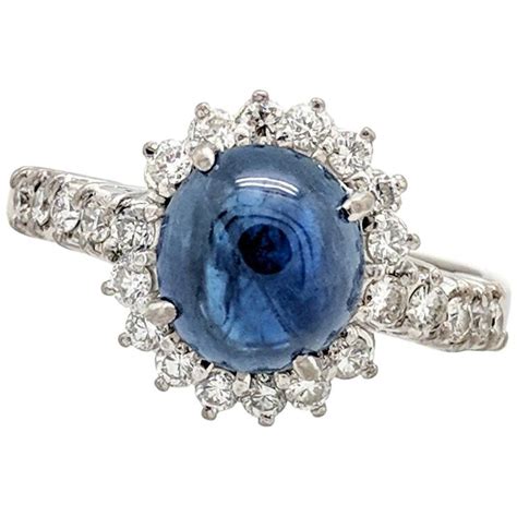 14 Karat White Gold Blue Star Sapphire And Diamond Halo Ring At 1stdibs