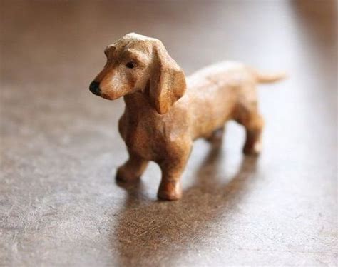 A Small Toy Dog Standing On Top Of A Wooden Table