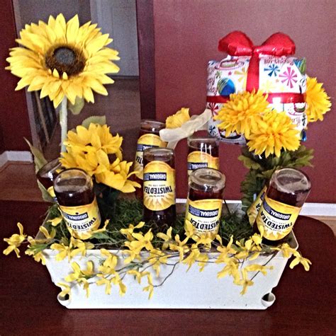 R to rotate while placing. Twisted tea gift for my husband! I used fake flowers ...