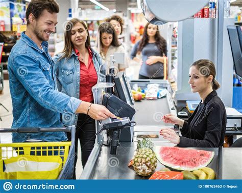 People Buying Goods In A Grocery Store Stock Image - Image of business ...