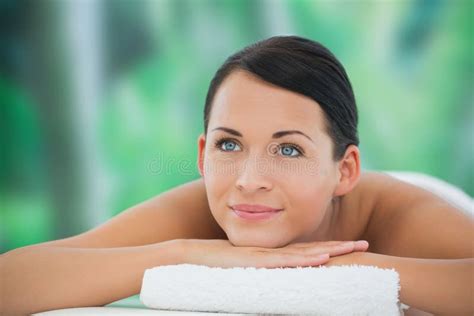 Beautiful Brunette Relaxing On Massage Table Smiling Stock Photo Image Of Front Female