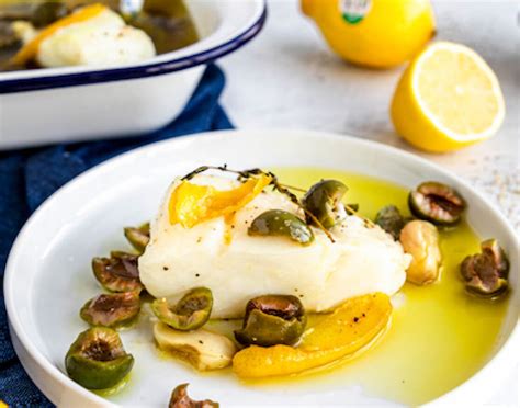 Olive Oil Poached White Fish With Lemons And Green Olives Have A Plant
