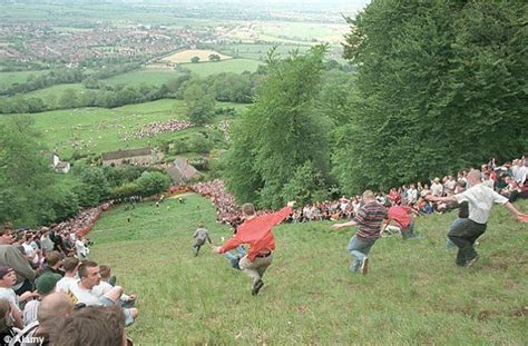 The Uks Weirdest Tourist Events From Cheese Rolling To Welly Wanging