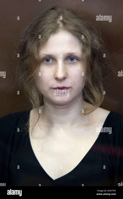 Feminist Punk Group Pussy Riot Member Maria Alekhina Sits Inside A Glass Cage At A Court In