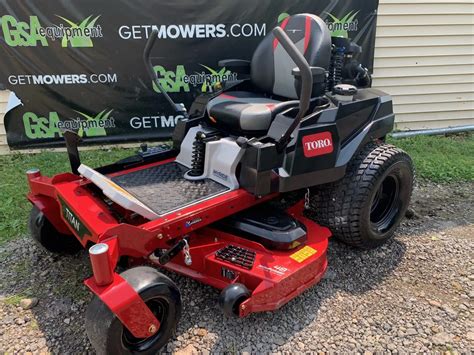 IN TORO TITAN HEAVY DUTY ZERO TURN WITH ONLY HOURS A MONTH