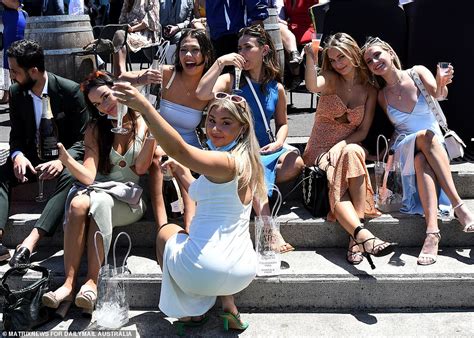 aussies go wild race goers celebrate the return of melbourne cup after world s longest lockdown