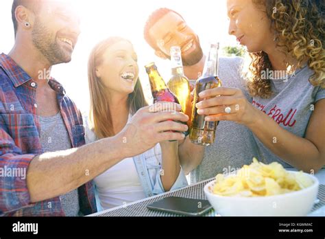 Group Of Friends Cheering With Beers Stock Photo Alamy