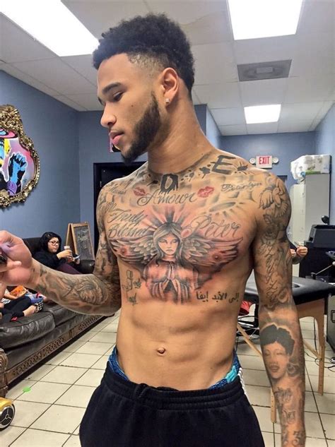 Pin on fdbf | Black men tattoos, Chest tattoo men, Cool chest tattoos