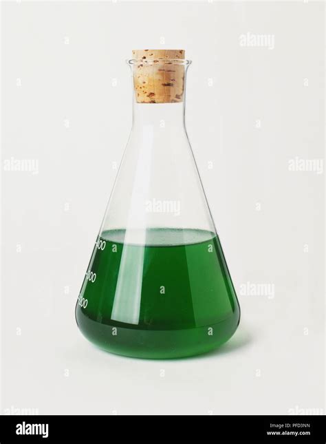 A Laboratory Beaker Filled With Green Liquid Stock Photo Alamy