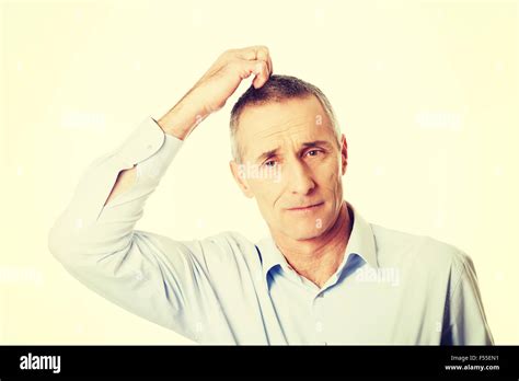 Confused Man Scratching His Head Stock Photo Alamy