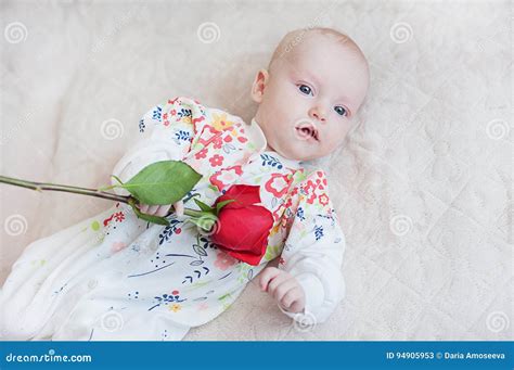 Cute Baby Girl Holding A Bouquet Of Flowers Rose Stock Image Image Of