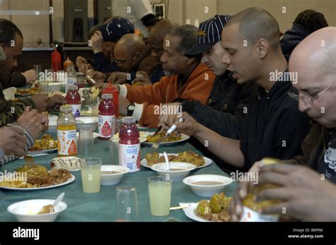 Homeless Men Eat At The New York City Rescue Mission Soup Kitchen In