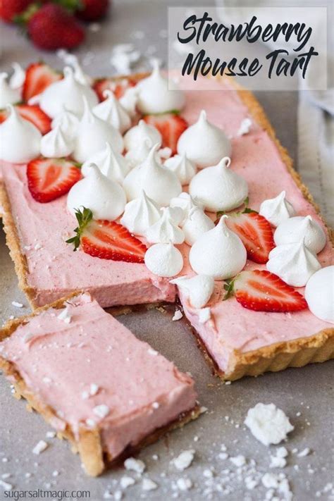 A Piece Of Pie With Whipped Cream And Strawberries On Top Is Sitting On