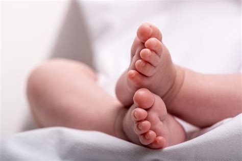Premium Photo Newborn Baby Feet On A White Blanket Feet Of Baby Boy