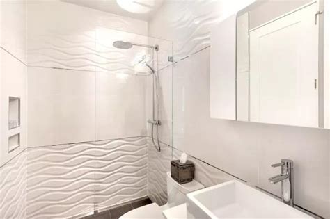 A small modern bathroom outfitted with white subway tile and gray penny tile could look pretty plain but an interesting country sink and round galvanized mirror add an unexpected touch. Modern Bathroom Design Trends 2020, Vibrant Colors of ...